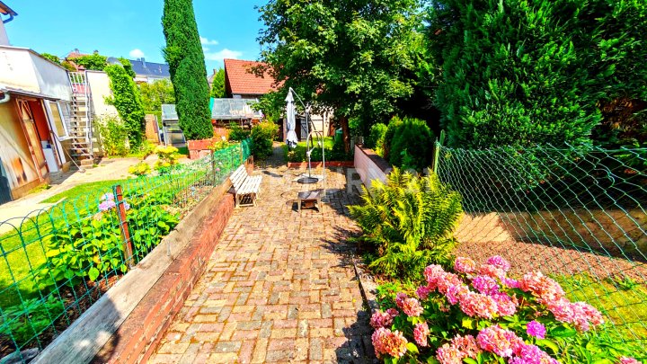 Kleines Juwel mit Charme – gemütliches Einfamilienhaus mit Garten und 2 Stellplätzen