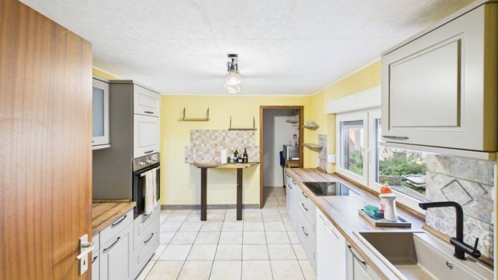 Einfamilienhaus in Merchweiler – modernisiert 2024, 102 m² Wohnfläche und großer Garten!