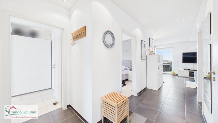 ORSCHOLZ: HELLE, SEHR GEPFLEGTE WOHNUNG (2 SCHLAFZI.) MIT ÜBERDACHTEM STELLPLATZ!